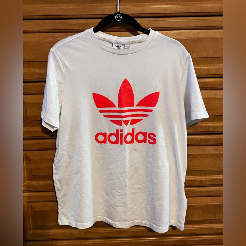 Women’s adidas white T-shirt with bright orange lettering
